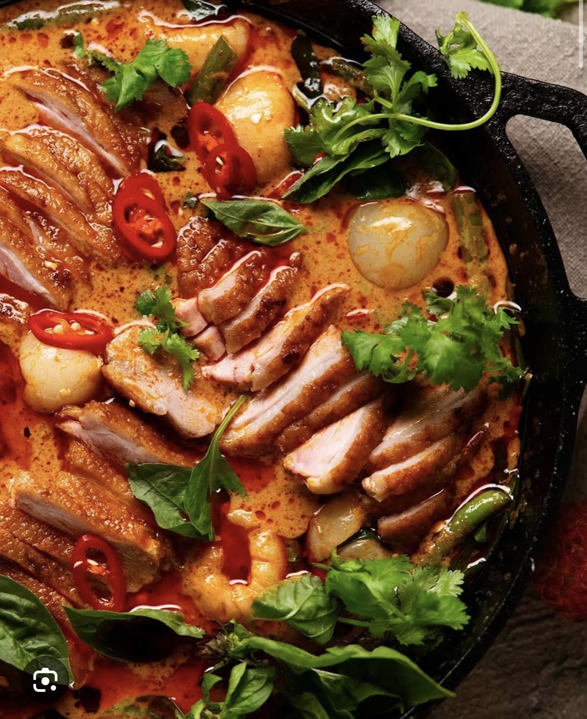 Curry in a skillet with herbs